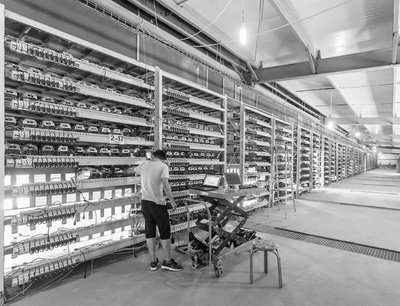 A vast cryptocurrency mining farm with thousands of miners